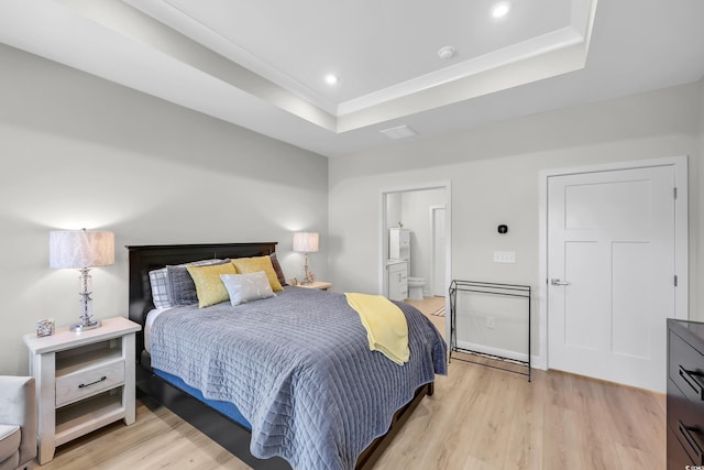 8906 Freya Way Unit 24A, Longs, SC 29568 - bedroom featuring a tray ceiling, light wood-type flooring, recessed lighting, and ensuite bath