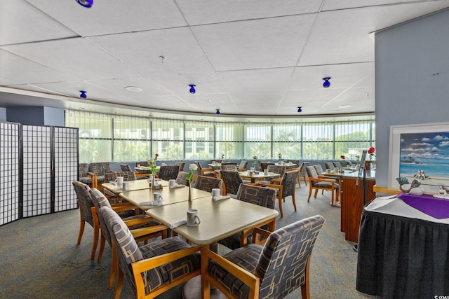304 N Ocean Blvd Unit 1402, North Myrtle Beach, SC 29582 - carpeted dining room featuring a paneled ceiling and healthy amount of natural light