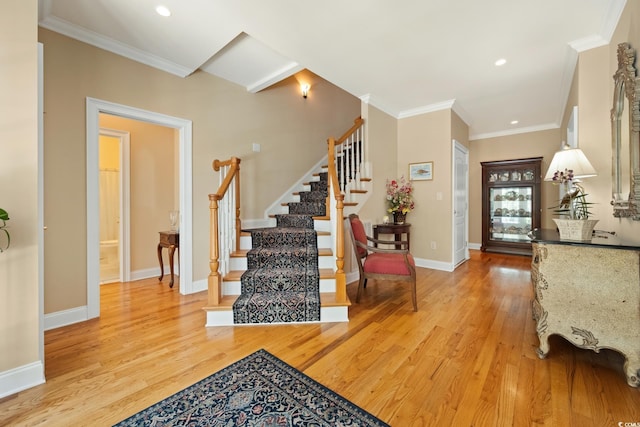3085 Luvan Blvd, Georgetown, SC 29440 - foyer entrance with light wood-type flooring, stairway, crown molding, and recessed lighting