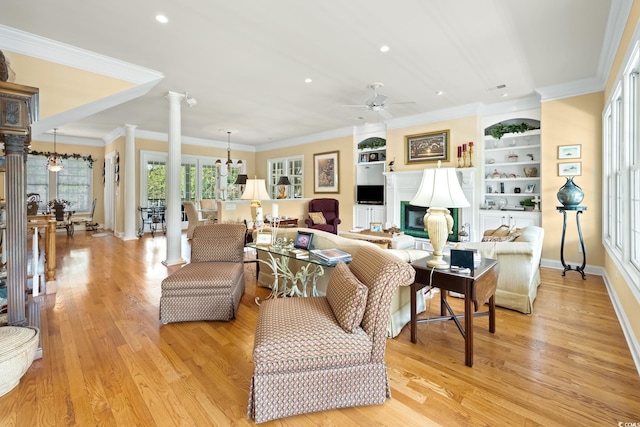 3085 Luvan Blvd, Georgetown, SC 29440 - living room featuring ornate columns, ceiling fan, light wood finished floors, recessed lighting, and built in shelves