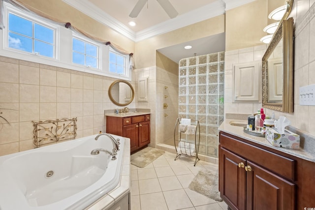 3085 Luvan Blvd, Georgetown, SC 29440 - bathroom with tile walls, crown molding, a whirlpool tub, a walk in shower, and two vanities