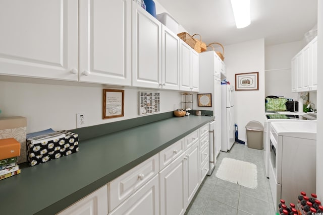 3085 Luvan Blvd, Georgetown, SC 29440 - laundry room with independent washer and dryer, cabinet space, and light tile patterned flooring