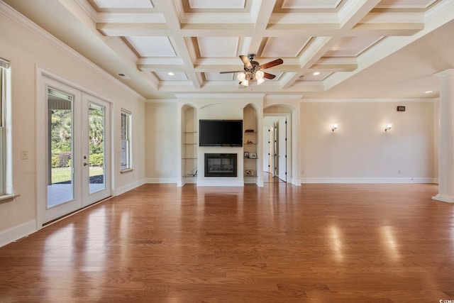 8444 Juxa Dr, Myrtle Beach, SC 29579 - unfurnished living room with french doors, wood finished floors, ceiling fan, beamed ceiling, and coffered ceiling
