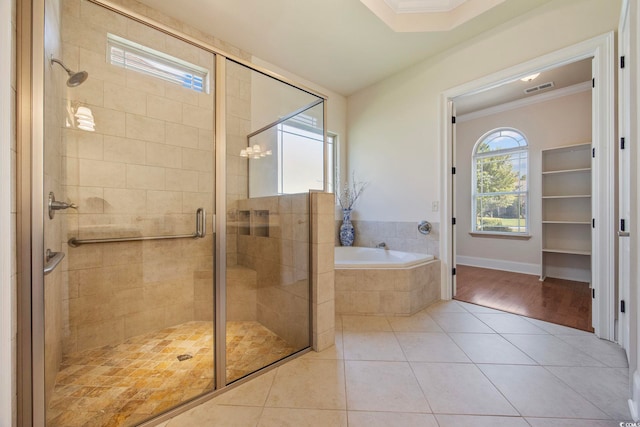 8444 Juxa Dr, Myrtle Beach, SC 29579 - bathroom featuring a bath, ornamental molding, tile patterned flooring, and a shower stall