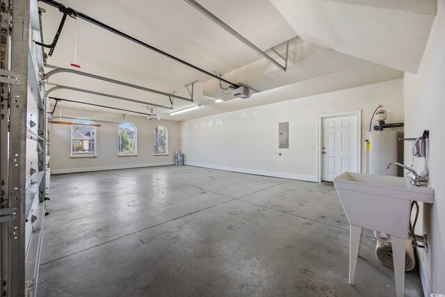 8444 Juxa Dr, Myrtle Beach, SC 29579 - garage featuring water heater, electric panel, and a garage door opener