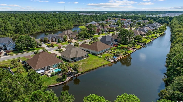 8444 Juxa Dr, Myrtle Beach, SC 29579 - aerial view of residential area with a nearby body of water and a heavily wooded area