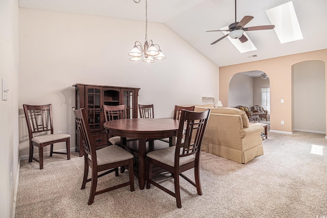 4530 Lighthouse Dr Unit 31-C, Little River, SC 29566 - dining space with arched walkways, light carpet, ceiling fan, high vaulted ceiling, and a skylight