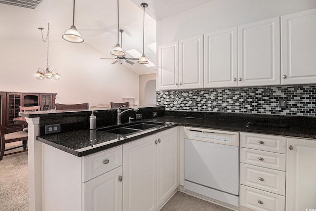4530 Lighthouse Dr Unit 31-C, Little River, SC 29566 - kitchen with white dishwasher, a peninsula, a ceiling fan, white cabinets, and lofted ceiling