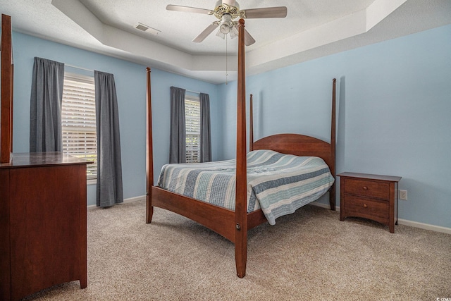 4530 Lighthouse Dr Unit 31-C, Little River, SC 29566 - bedroom featuring light carpet, a raised ceiling, and ceiling fan