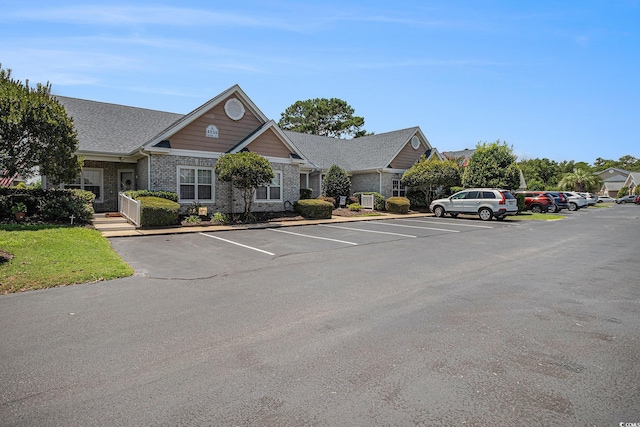 4530 Lighthouse Dr Unit 31-C, Little River, SC 29566 - view of building exterior with uncovered parking