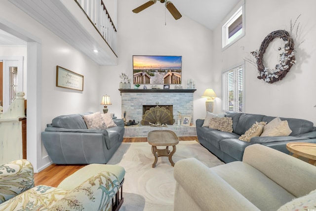 106 Furman Cir, Conway, SC 29526 - living area featuring wood finished floors, a brick fireplace, high vaulted ceiling, and ceiling fan