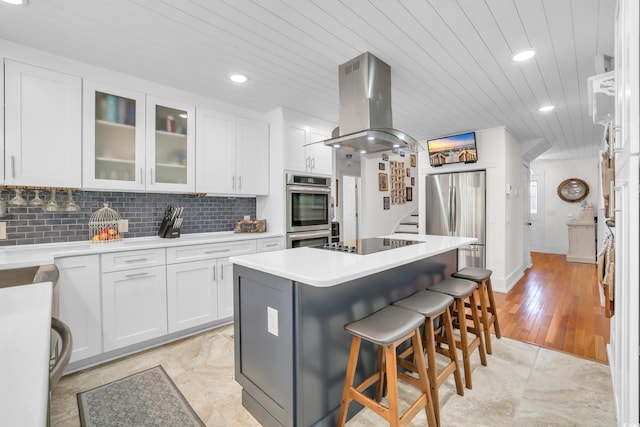 106 Furman Cir, Conway, SC 29526 - kitchen featuring island range hood, stainless steel appliances, white cabinetry, a breakfast bar area, and wooden ceiling