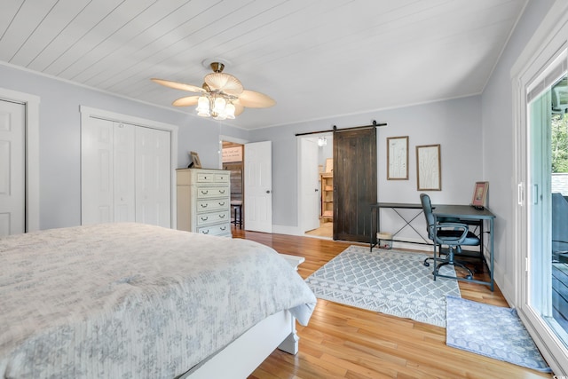 106 Furman Cir, Conway, SC 29526 - bedroom featuring a barn door, wood finished floors, access to outside, crown molding, and a ceiling fan