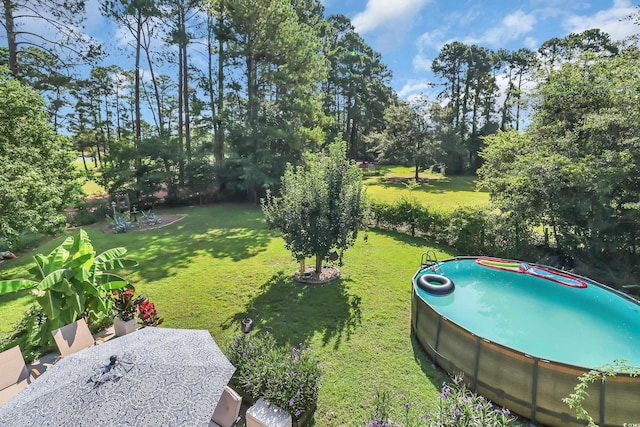 106 Furman Cir, Conway, SC 29526 - view of grassy yard with view of scattered trees and an outdoor pool