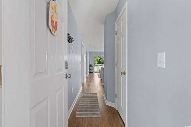 613 Waterway Village Blvd Unit 4-F, Myrtle Beach, SC 29579 - hallway featuring baseboards and wood finished floors