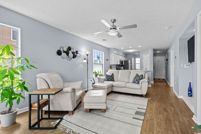 613 Waterway Village Blvd Unit 4-F, Myrtle Beach, SC 29579 - living area featuring a ceiling fan and wood finished floors