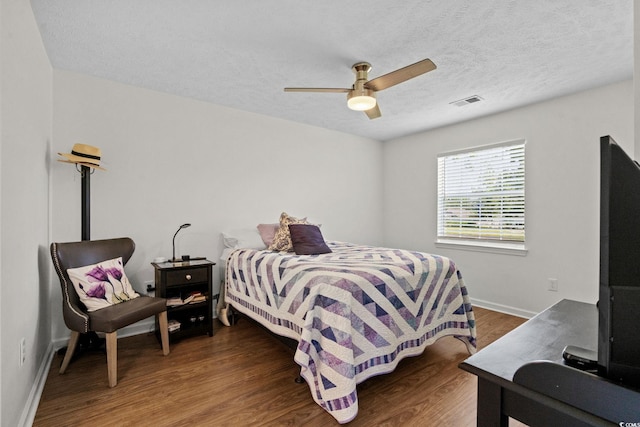 613 Waterway Village Blvd Unit 4-F, Myrtle Beach, SC 29579 - bedroom with wood finished floors, a ceiling fan, and a textured ceiling