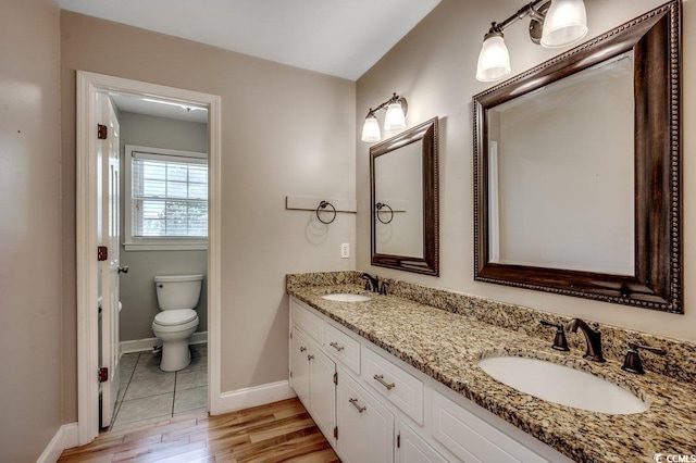 414 Dunes Dr, Myrtle Beach, SC 29572 - full bathroom with double vanity and wood finished floors