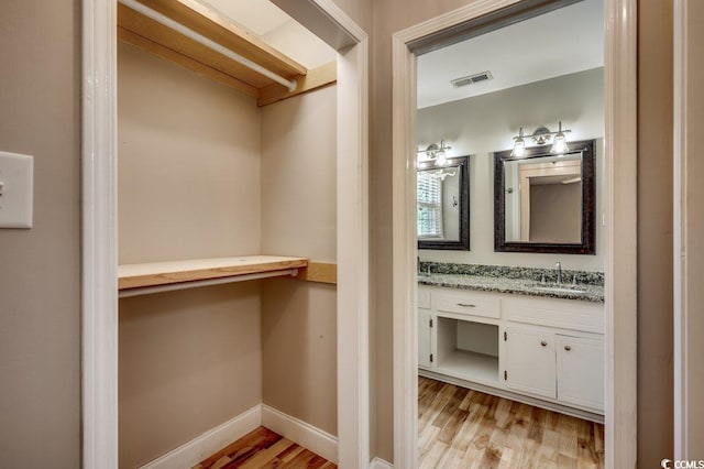 414 Dunes Dr, Myrtle Beach, SC 29572 - bathroom with vanity and wood finished floors
