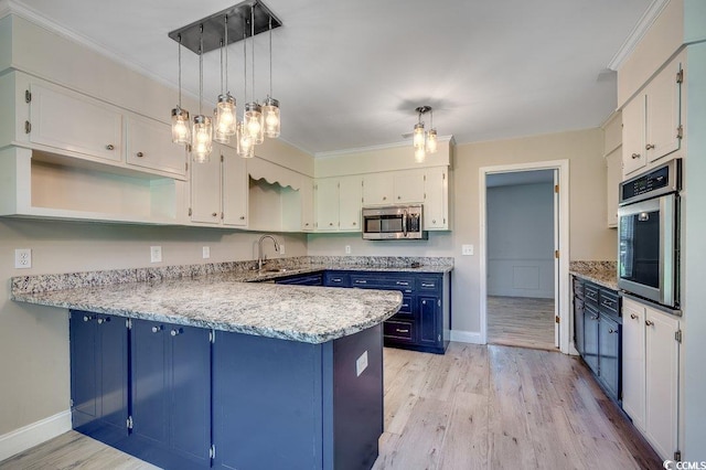 414 Dunes Dr, Myrtle Beach, SC 29572 - kitchen with blue cabinets, stainless steel appliances, a peninsula, light wood-type flooring, and white cabinets