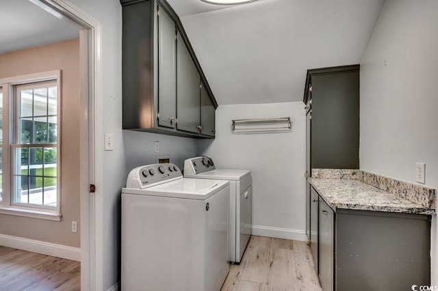 414 Dunes Dr, Myrtle Beach, SC 29572 - laundry area with cabinet space, washer and dryer, and light wood-style flooring