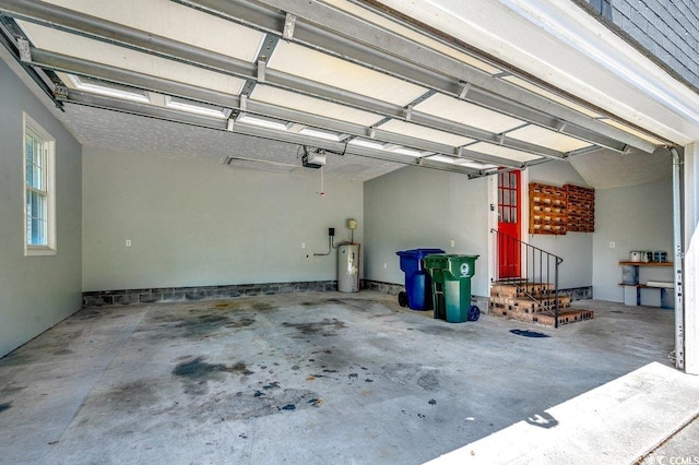414 Dunes Dr, Myrtle Beach, SC 29572 - garage featuring water heater and a garage door opener