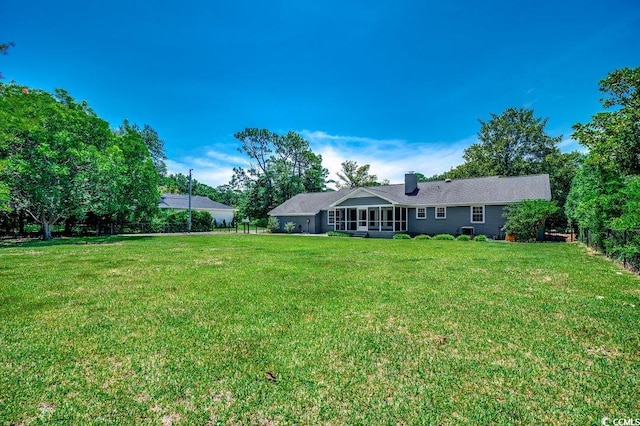 414 Dunes Dr, Myrtle Beach, SC 29572 - rear view of property featuring a chimney