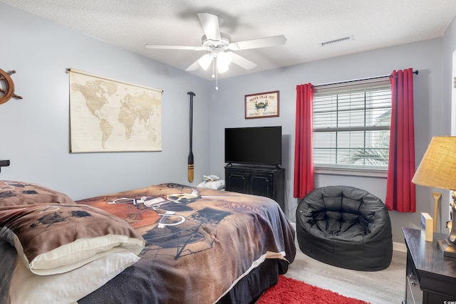 919 Dock Pl, Murrells Inlet, SC 29576 - bedroom featuring wood finished floors, a ceiling fan, and a textured ceiling