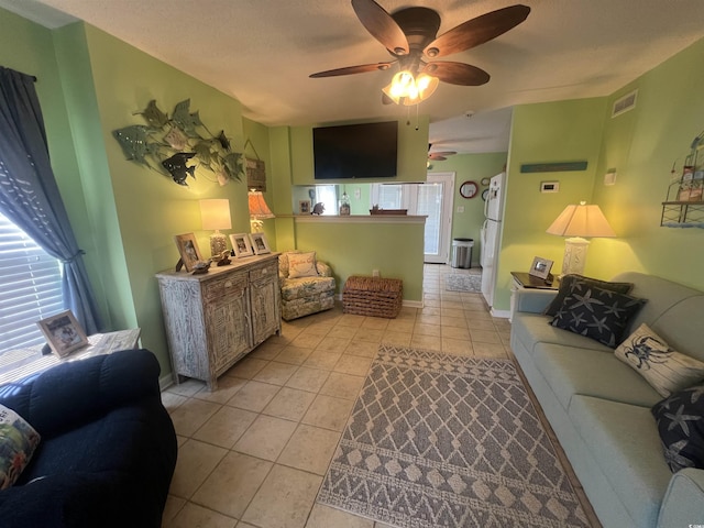919 Dock Pl, Murrells Inlet, SC 29576 - living room featuring a ceiling fan and light tile patterned floors