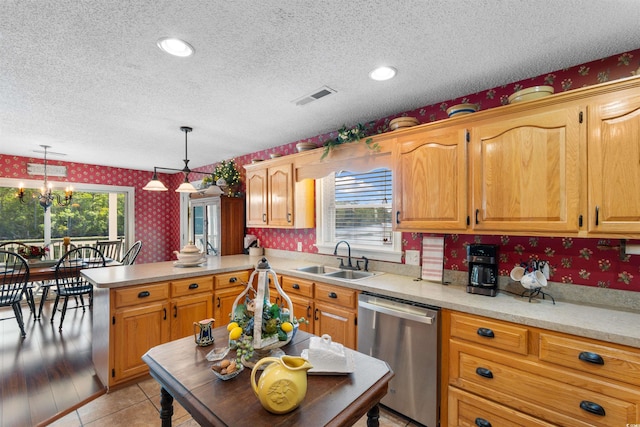 460 River Front St S, Conway, SC 29527 - kitchen featuring dishwasher, wallpapered walls, a textured ceiling, a peninsula, and light countertops