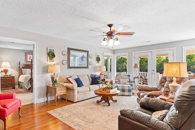460 River Front St S, Conway, SC 29527 - living room with a ceiling fan, wood finished floors, french doors, and a textured ceiling