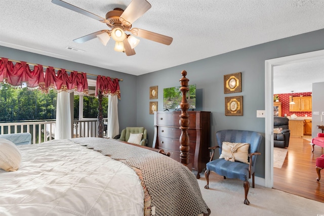 460 River Front St S, Conway, SC 29527 - bedroom with access to exterior, a textured ceiling, ceiling fan, and carpet floors