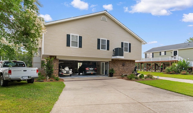 460 River Front St S, Conway, SC 29527 - view of front of property featuring a garage, a front yard, concrete driveway, and brick siding