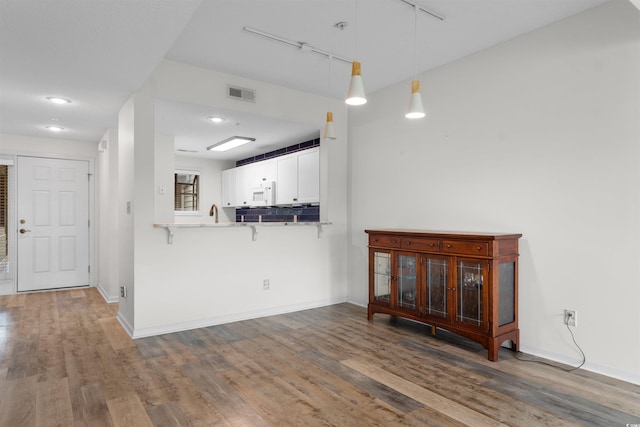 1551 Spinnaker Dr Unit 5935, North Myrtle Beach, SC 29582 - living area with wood finished floors and rail lighting