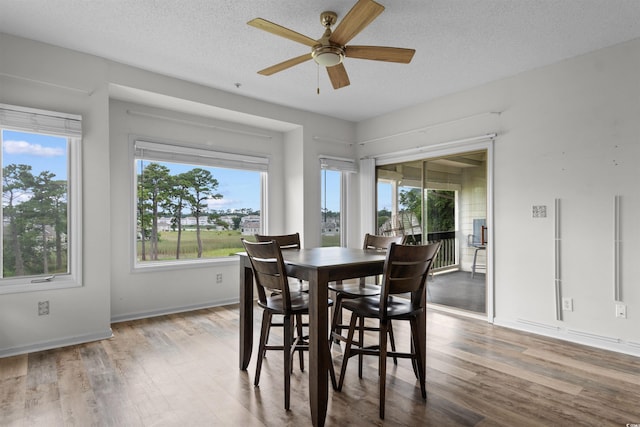 1551 Spinnaker Dr Unit 5935, North Myrtle Beach, SC 29582 - dining space with wood finished floors, a ceiling fan, and a textured ceiling