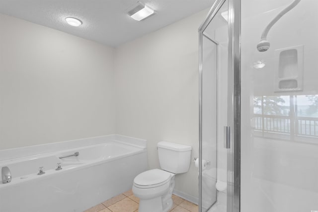 1551 Spinnaker Dr Unit 5935, North Myrtle Beach, SC 29582 - bathroom featuring a bath, tile patterned floors, a stall shower, and a textured ceiling