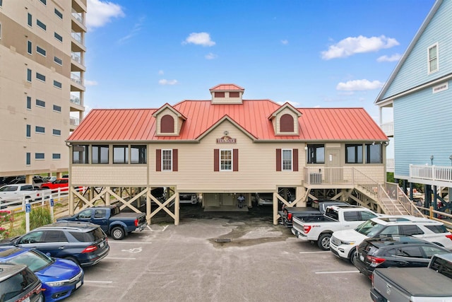 1551 Spinnaker Dr Unit 5935, North Myrtle Beach, SC 29582 - view of building exterior with uncovered parking and stairs