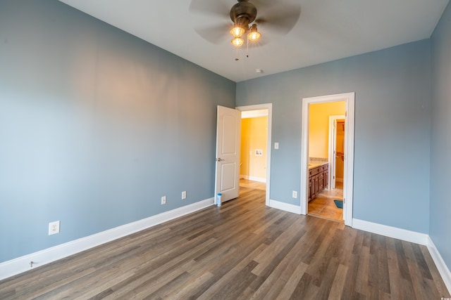 4302 Grande Harbour Blvd Unit 4302, Little River, SC 29566 - unfurnished bedroom featuring dark wood-style flooring and connected bathroom