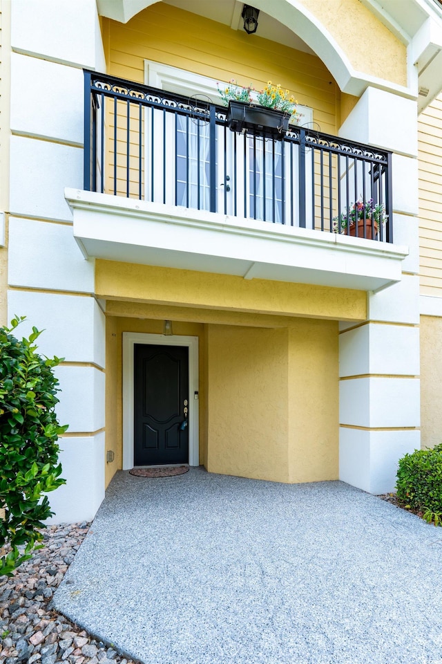 4302 Grande Harbour Blvd Unit 4302, Little River, SC 29566 - property entrance with a balcony and stucco siding