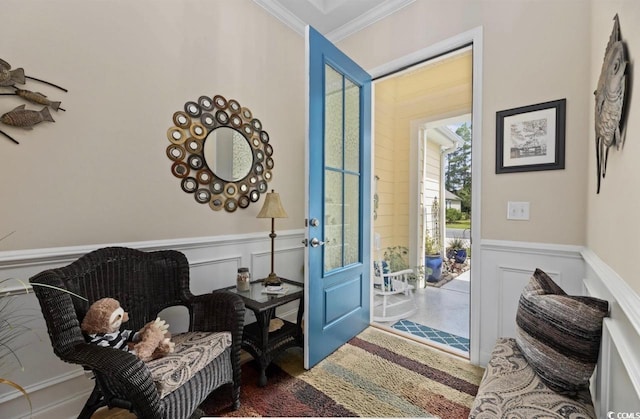 216 Coral Beach Cir, Myrtle Beach, SC 29575 - foyer entrance featuring crown molding, a wainscoted wall, and a decorative wall