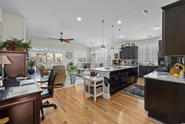 216 Coral Beach Cir, Myrtle Beach, SC 29575 - kitchen with ceiling fan, light wood-style flooring, an island with sink, decorative light fixtures, and recessed lighting