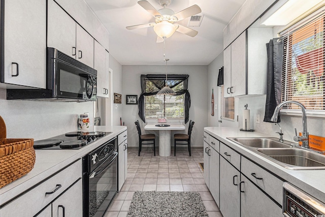 964 Oakwood Ln, Myrtle Beach, SC 29572 - kitchen with black appliances, light countertops, ceiling fan, and white cabinets