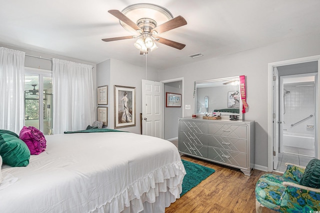 964 Oakwood Ln, Myrtle Beach, SC 29572 - bedroom featuring wood finished floors, ensuite bath, and a ceiling fan