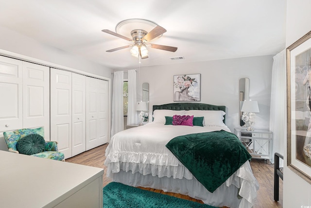 964 Oakwood Ln, Myrtle Beach, SC 29572 - bedroom with wood finished floors, a closet, and a ceiling fan