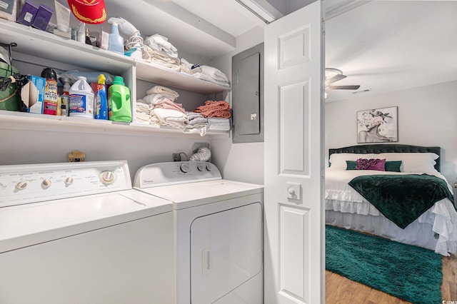 964 Oakwood Ln, Myrtle Beach, SC 29572 - laundry room featuring washer and dryer, wood finished floors, and electric panel