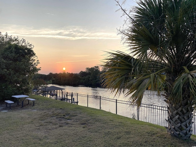 964 Oakwood Ln, Myrtle Beach, SC 29572 - yard at dusk with a water view