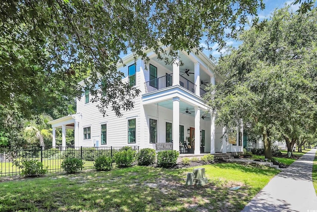 1320 James Island Ave, North Myrtle Beach, SC 29582 - neoclassical / greek revival house featuring a ceiling fan and a balcony