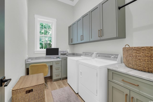 1320 James Island Ave, North Myrtle Beach, SC 29582 - washroom with cabinet space, washer and dryer, light wood finished floors, and a desk