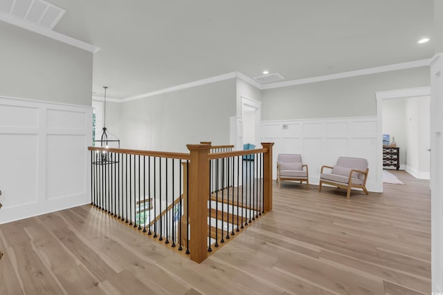 1320 James Island Ave, North Myrtle Beach, SC 29582 - hallway with a decorative wall, ornamental molding, wood finished floors, recessed lighting, and wainscoting