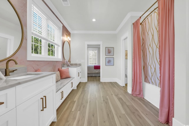 1320 James Island Ave, North Myrtle Beach, SC 29582 - bathroom with double vanity, healthy amount of natural light, wood finished floors, ornamental molding, and recessed lighting
